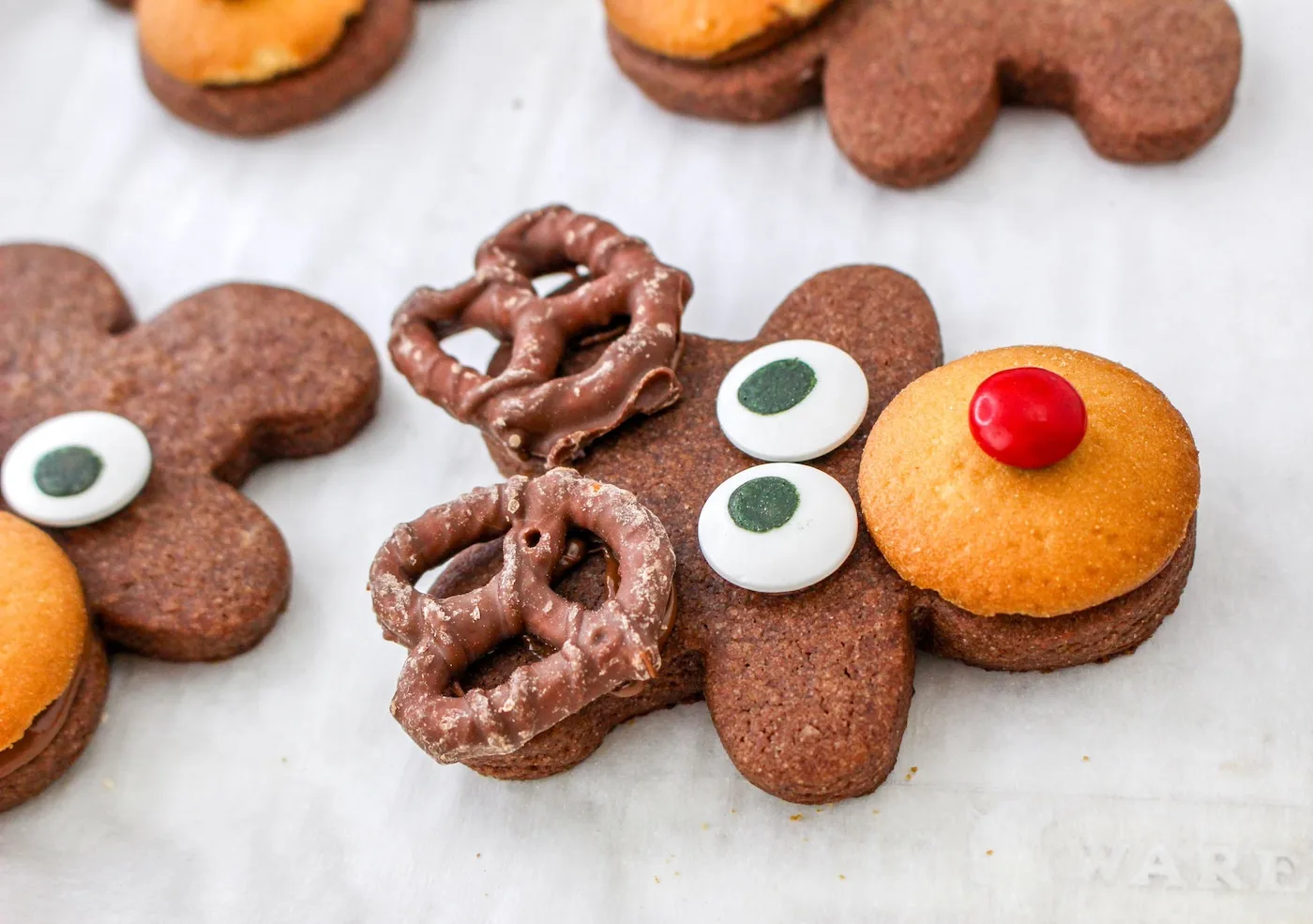 Eyes and pretzel antlers attached with chocolate