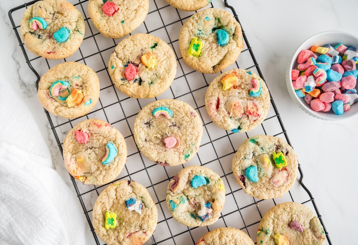 Baked lucky charm cookies on a wire rack
