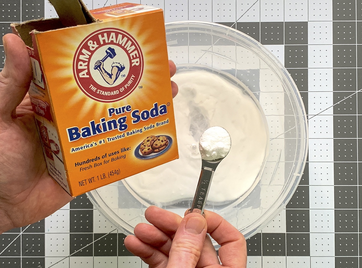 Adding baking soda to the glue and water