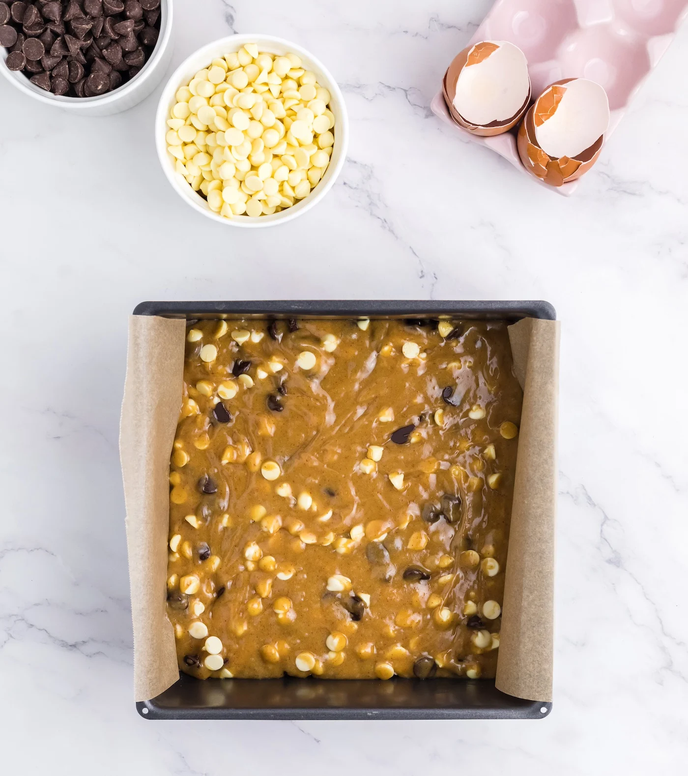 Blondie batter in a pan ready to go into the oven