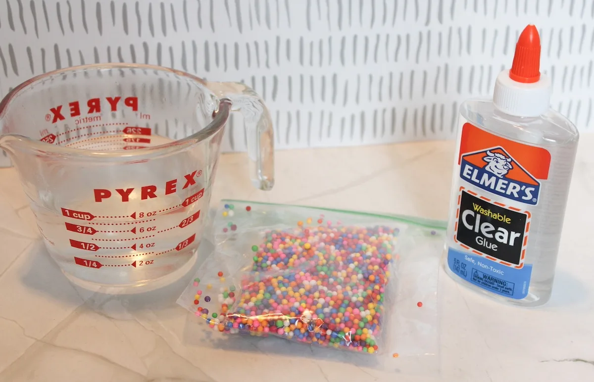 Borax mixed with water, foam beads, and the clear glue