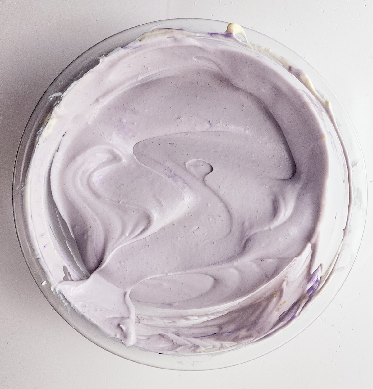 Color the custard with purple food coloring