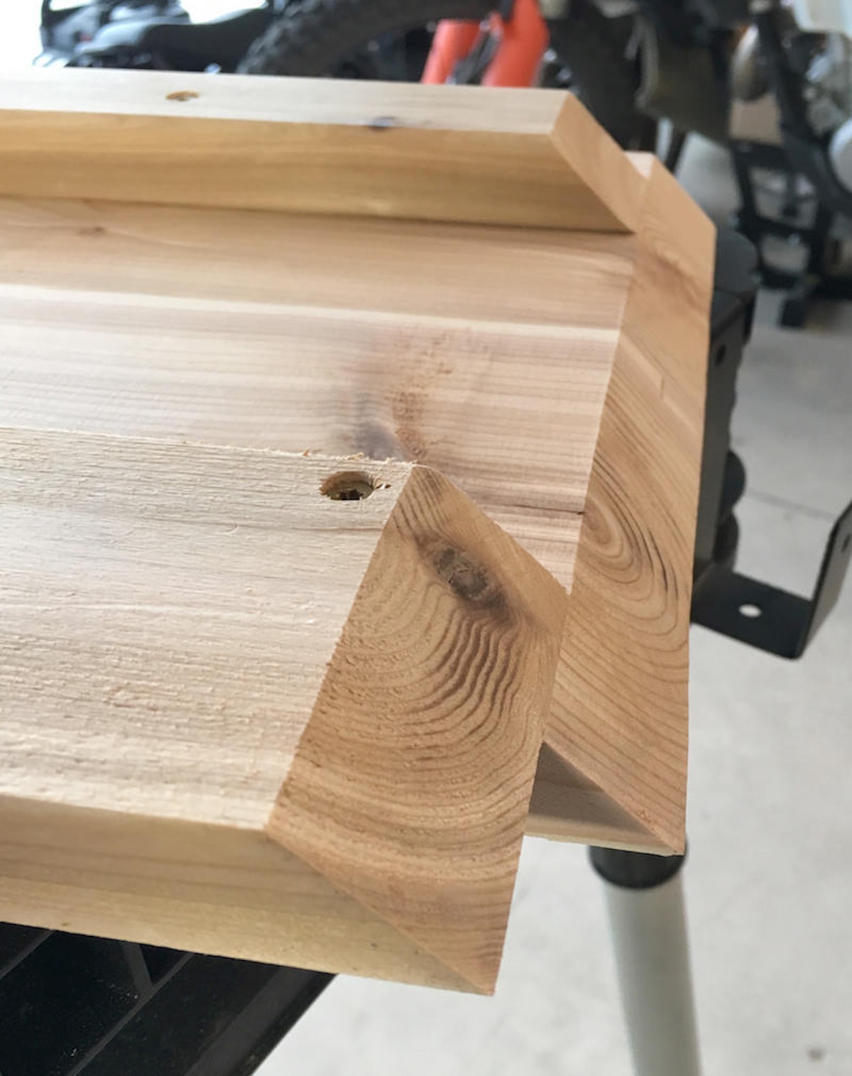 Cut 45 degree edges on both sides of the table frame with a saw