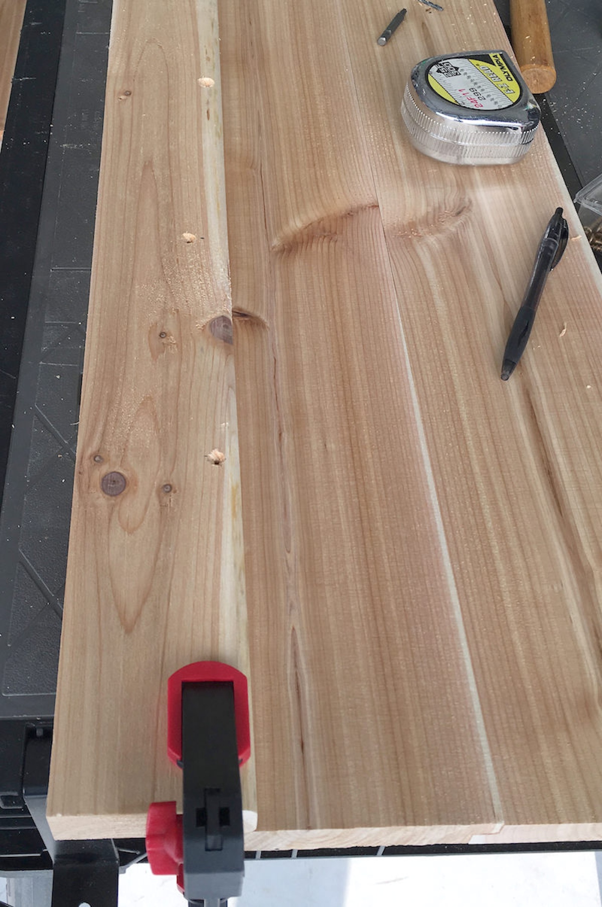 Drilled pilot holes on the base piece of the table