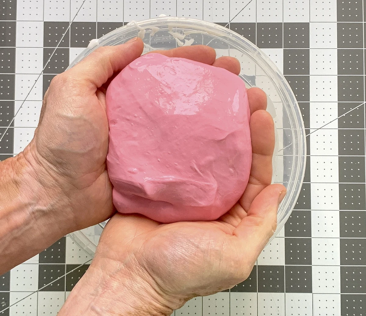 Finished ball of clay slime in a person's hands
