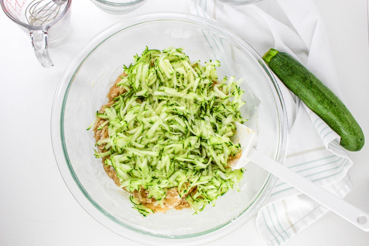 Fold the grated zucchini into the mixture