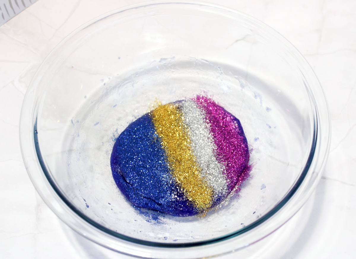 Folding glitter colors into the slime