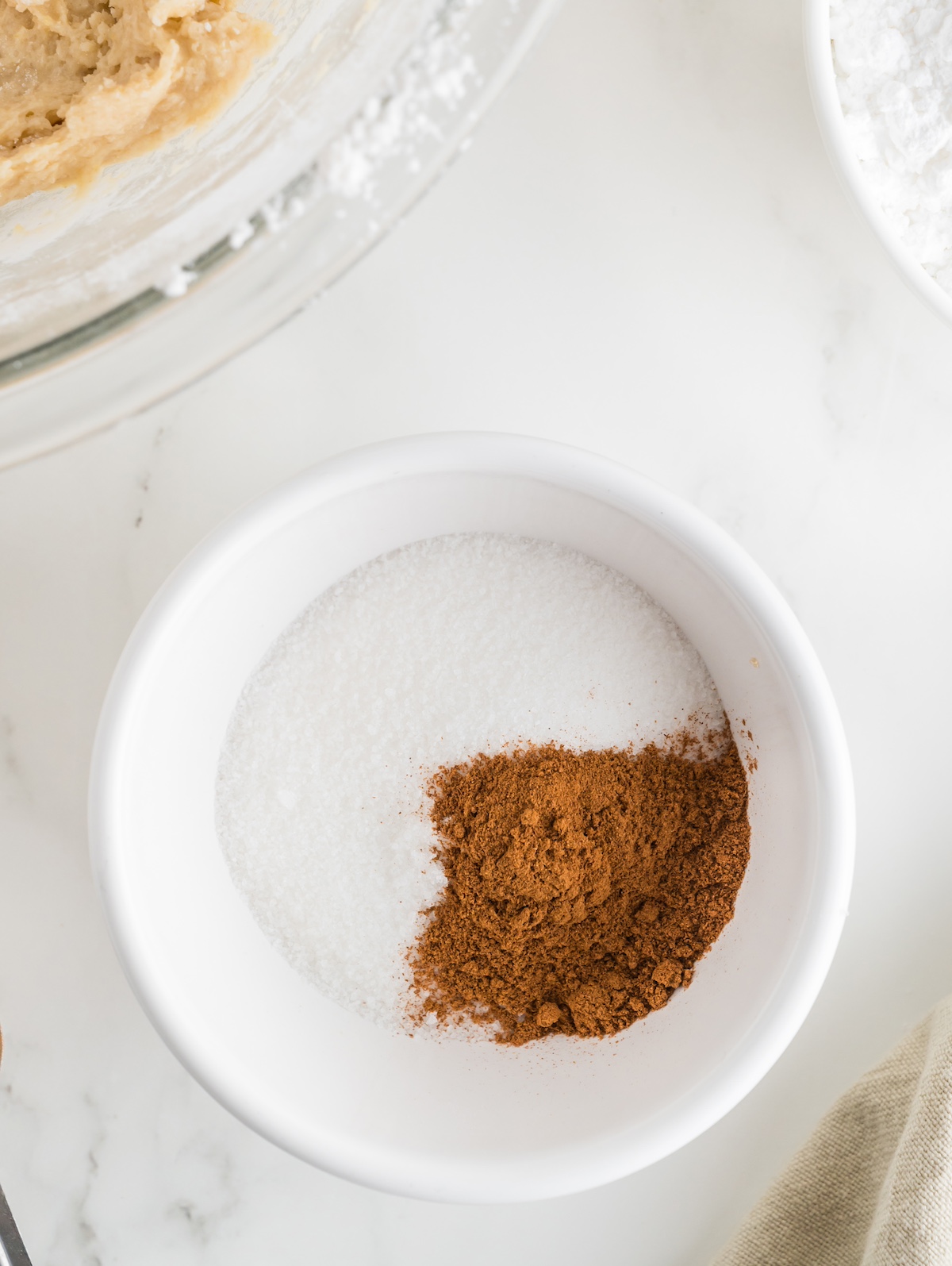 Stir together the white sugar and cinnamon in a small bowl
