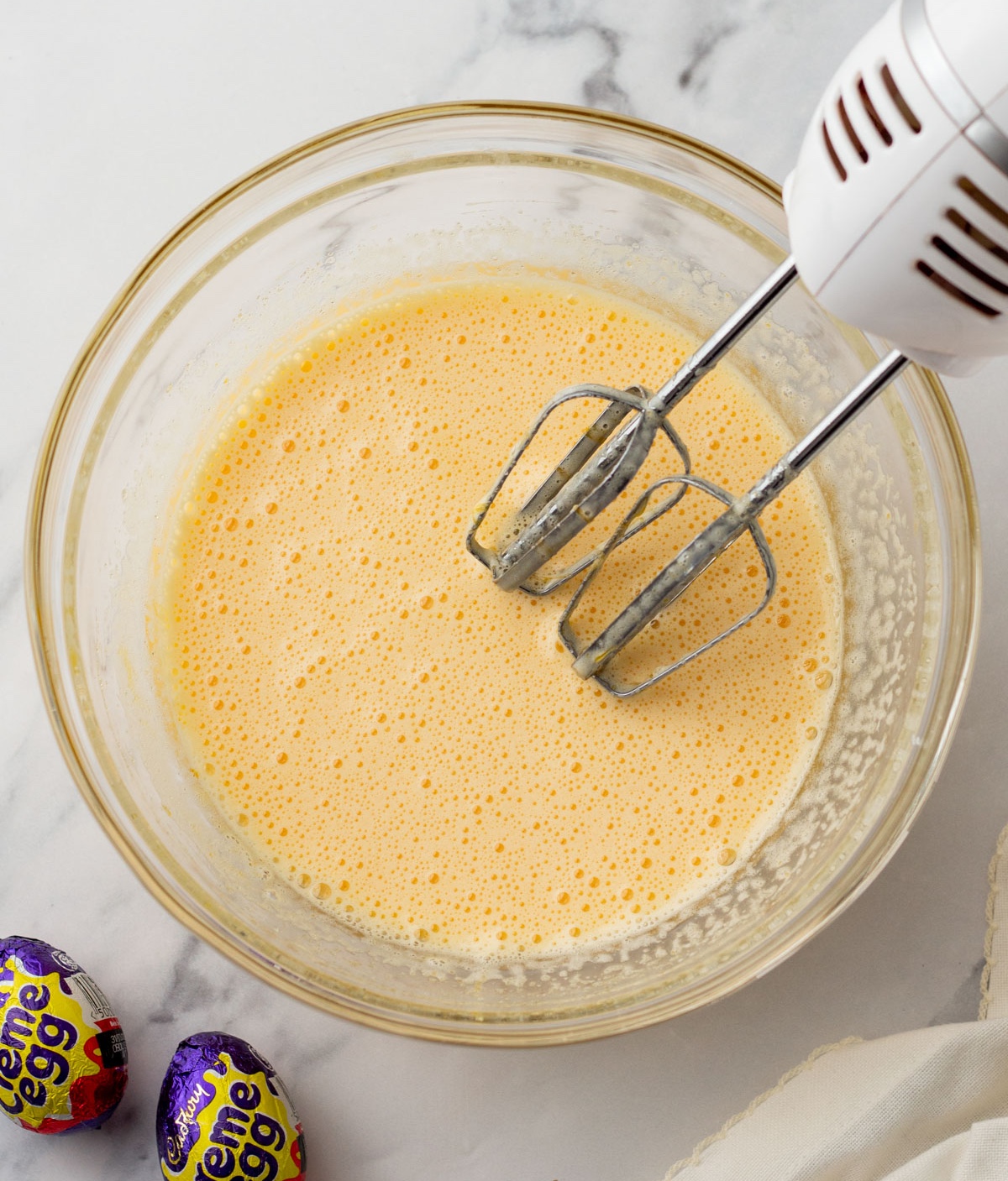 Sugar, eggs, and vanilla whisked together with a hand mixer