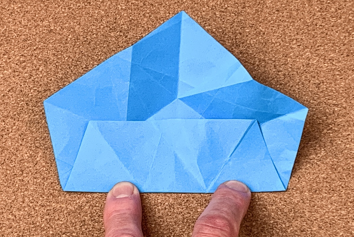 Fold-the-flat-bottom-edge-of-the-pentagon-up-and-repeat