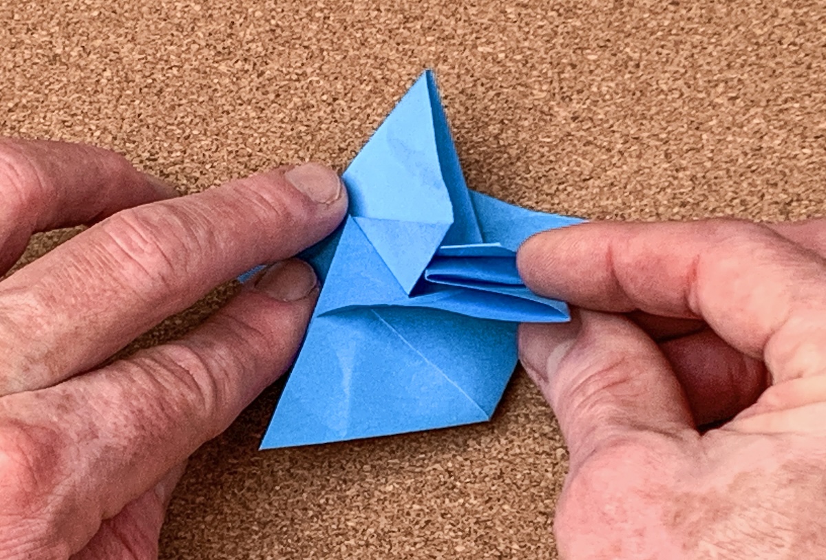 carefully-lift-up-the-first-side-and-insert-the-fifth-side-underneath-the-first-