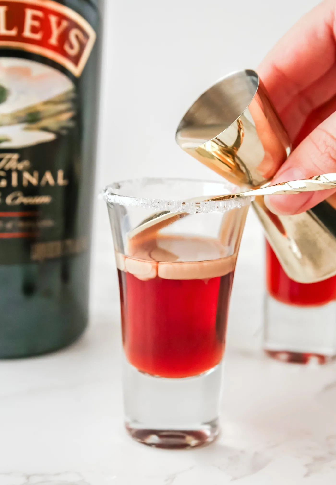 Add Baileys with a Bar Spoon