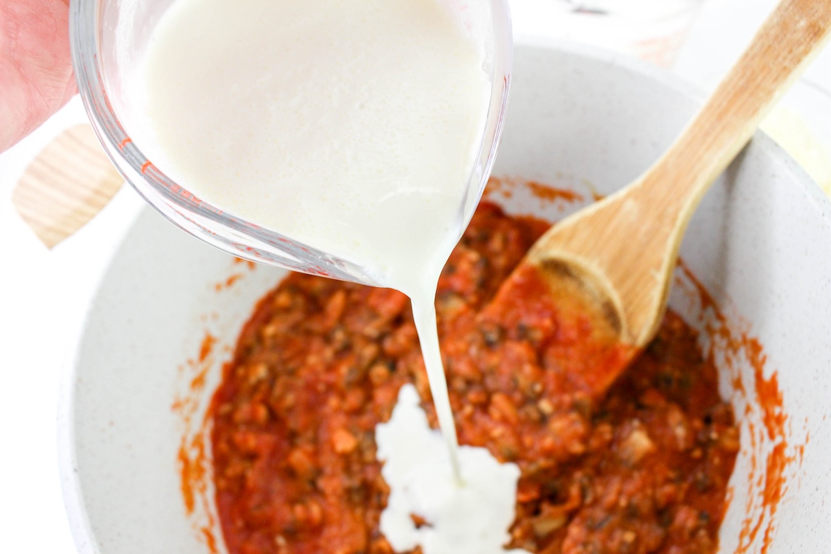 Add in the tomato sauce, milk, and cream