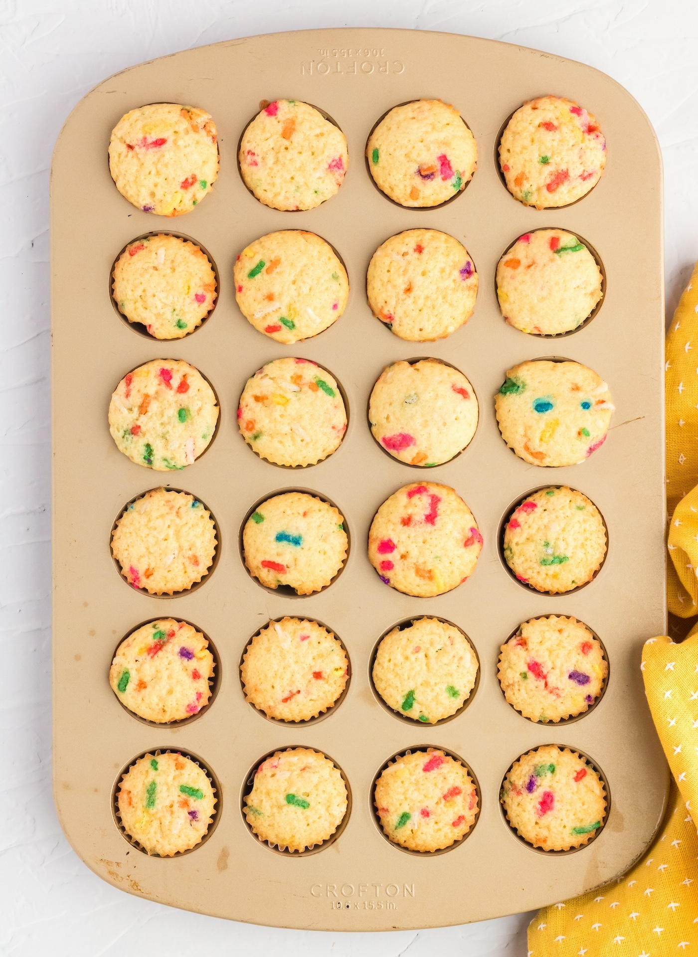 Baked mini muffins with sprinkles