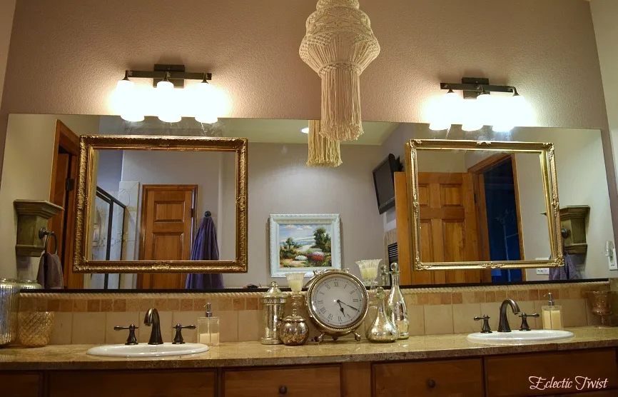 floating frames over bathroom mirror