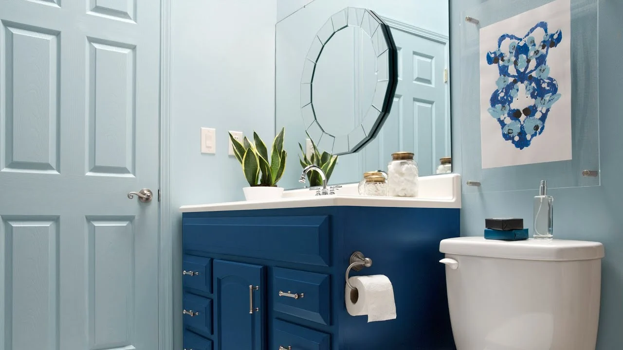 Add a more interesting mirror on top of your builder's grade bathroom mirror