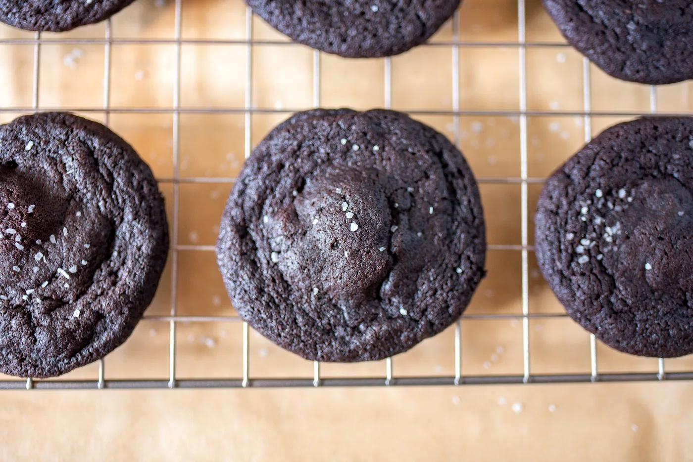 Dark chocolate cookies on a cooling rack