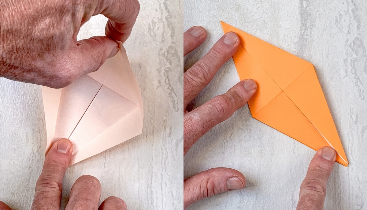 Pull one end of the triangle up and fold the side flaps in