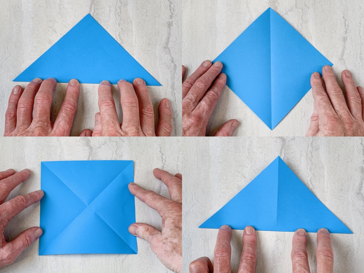 fold blue origami paper into a triangle, open, then turn and repeat