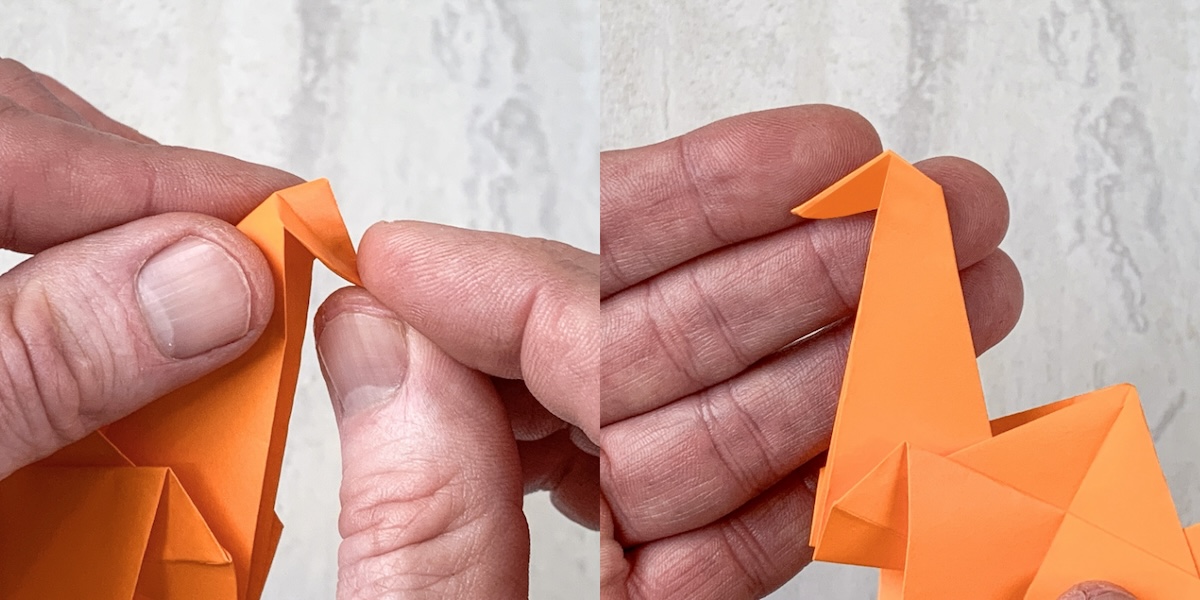 fold down the beak of the crane