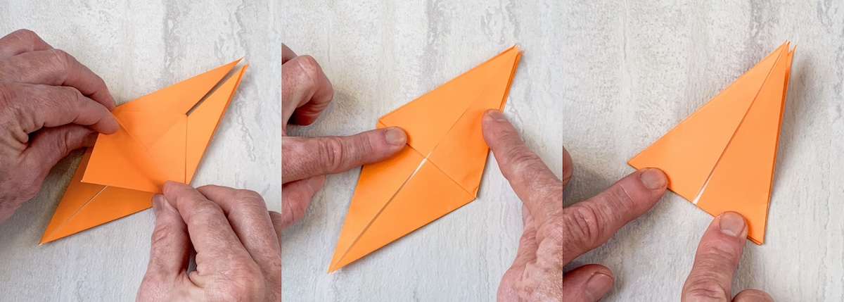 fold the bottom flap up then turn over and flip the other flap up
