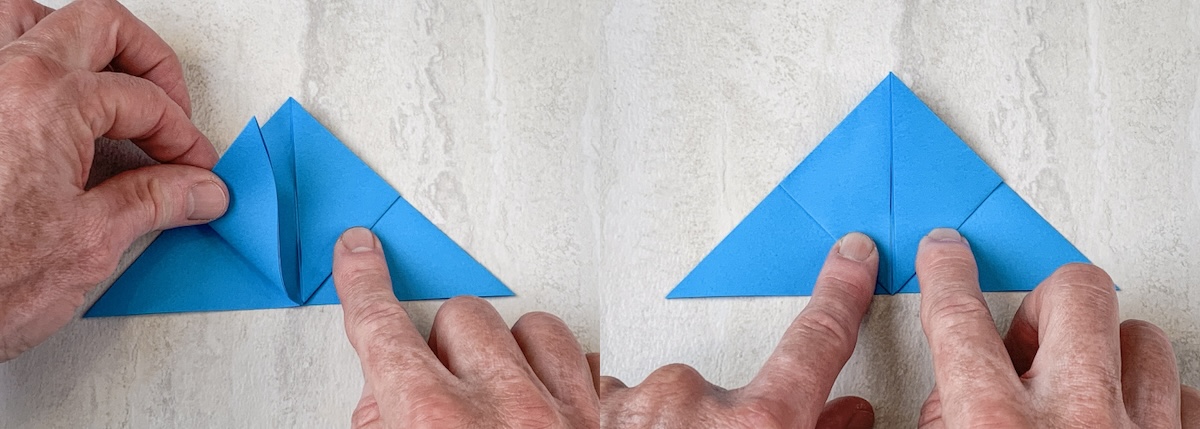 fold up the triangles on both sides toward the center