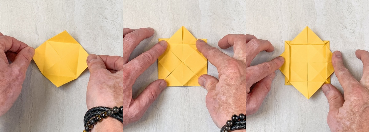 open the flaps and flip the base over, then fold the tips up and back