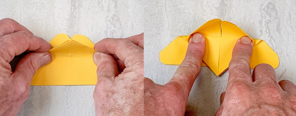 turn over and fold the point down a little bit past the base