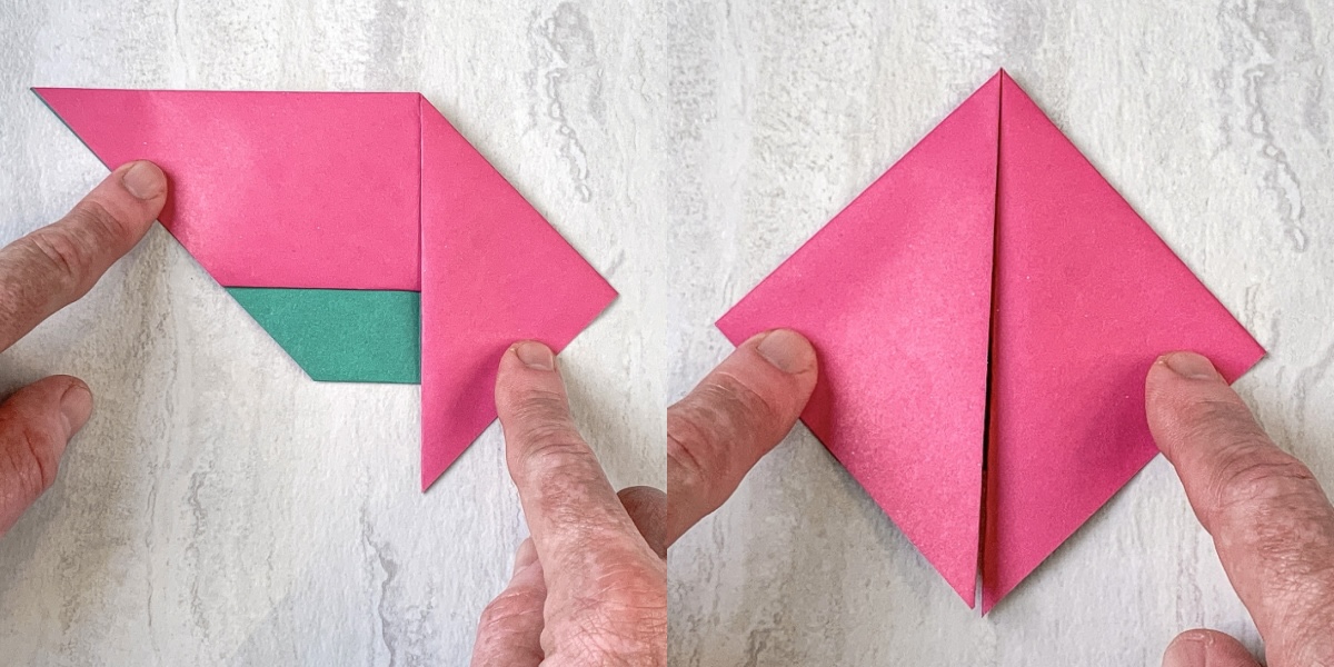 Fold down both points of the triangle toward the middle and crease
