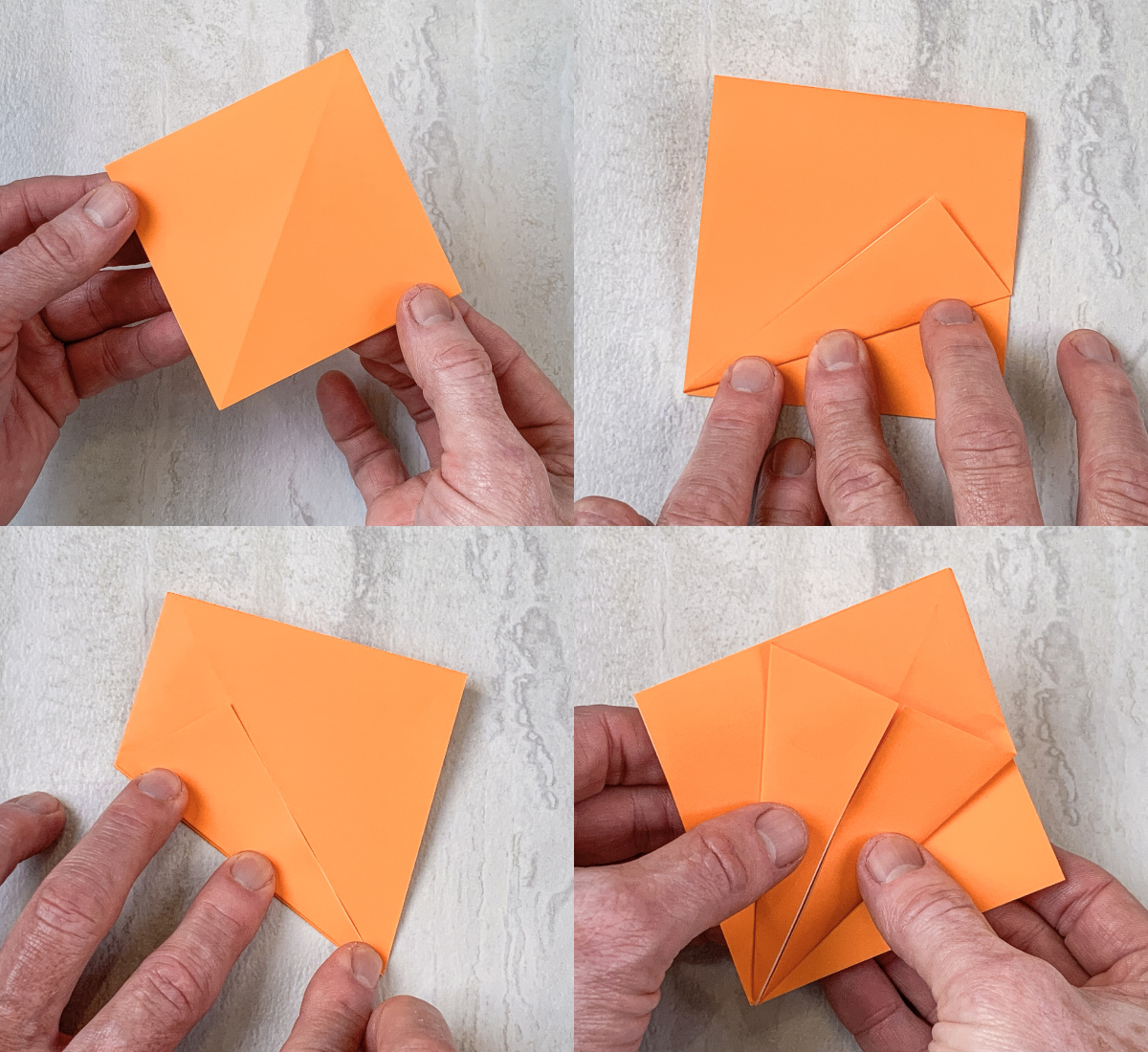 Fold in both sides of the orange square to the middle and then flip over and repeat