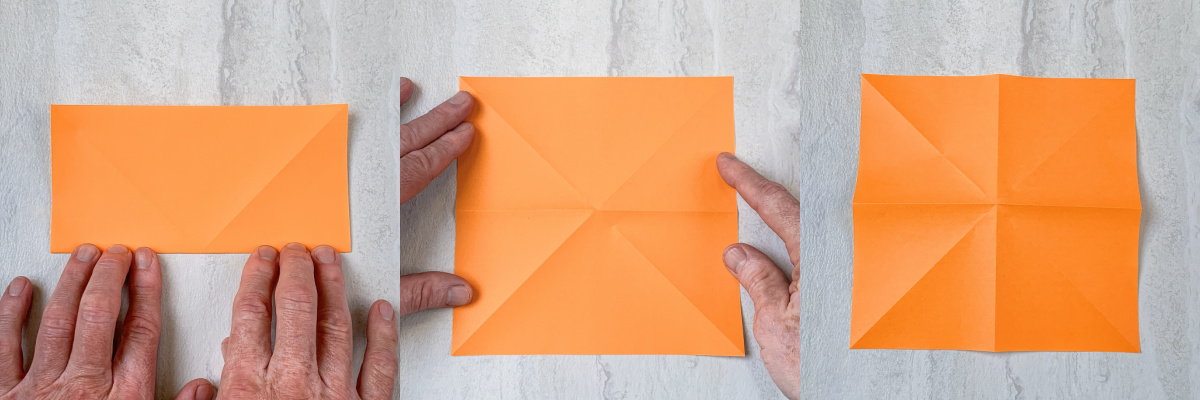 Fold the orange paper in half and then fold it in half the other way
