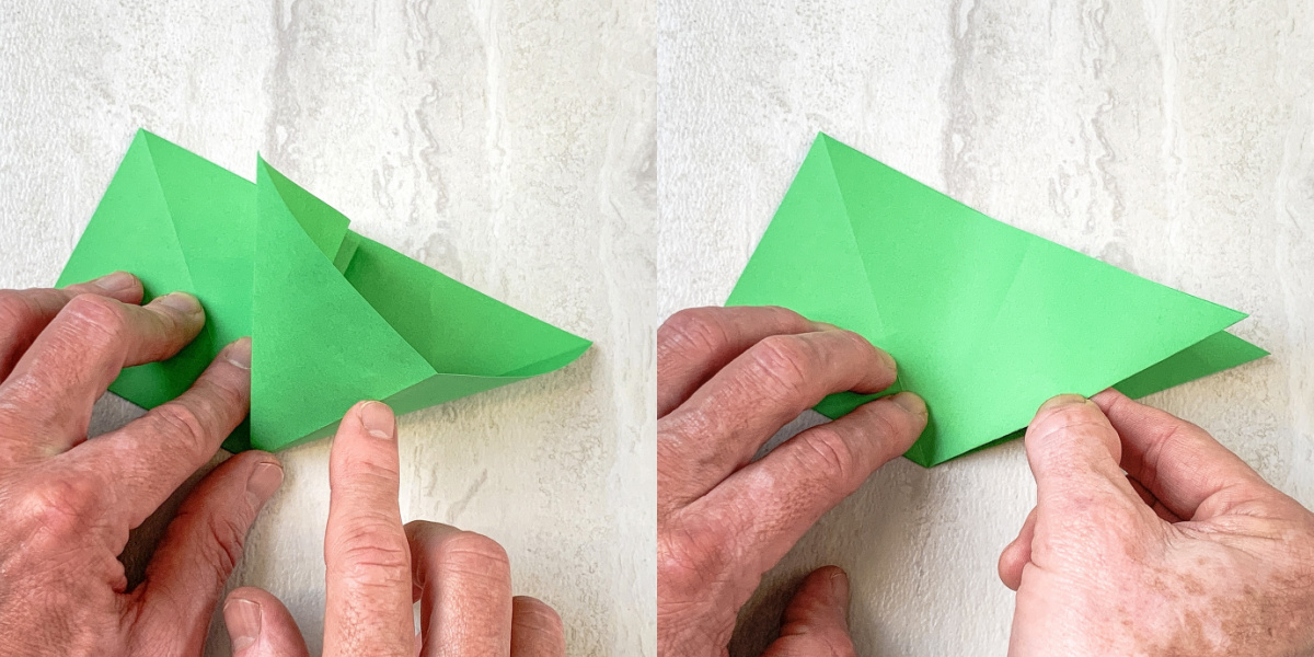 Leaving the paper folded in half fold in one side of the triangle