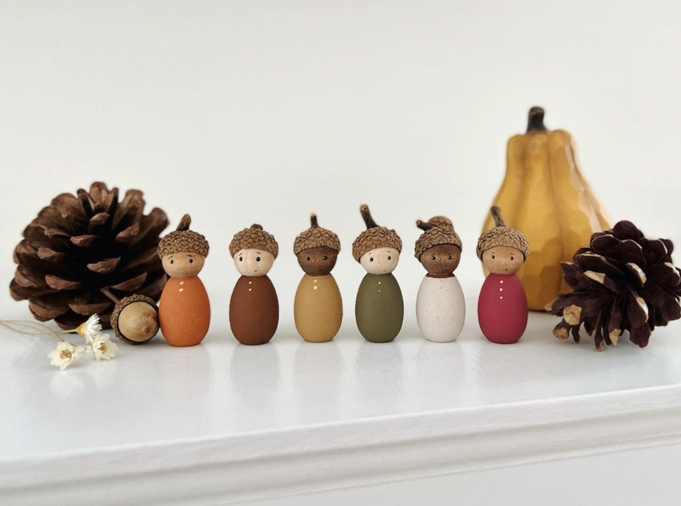 Peg dolls with acorn hats