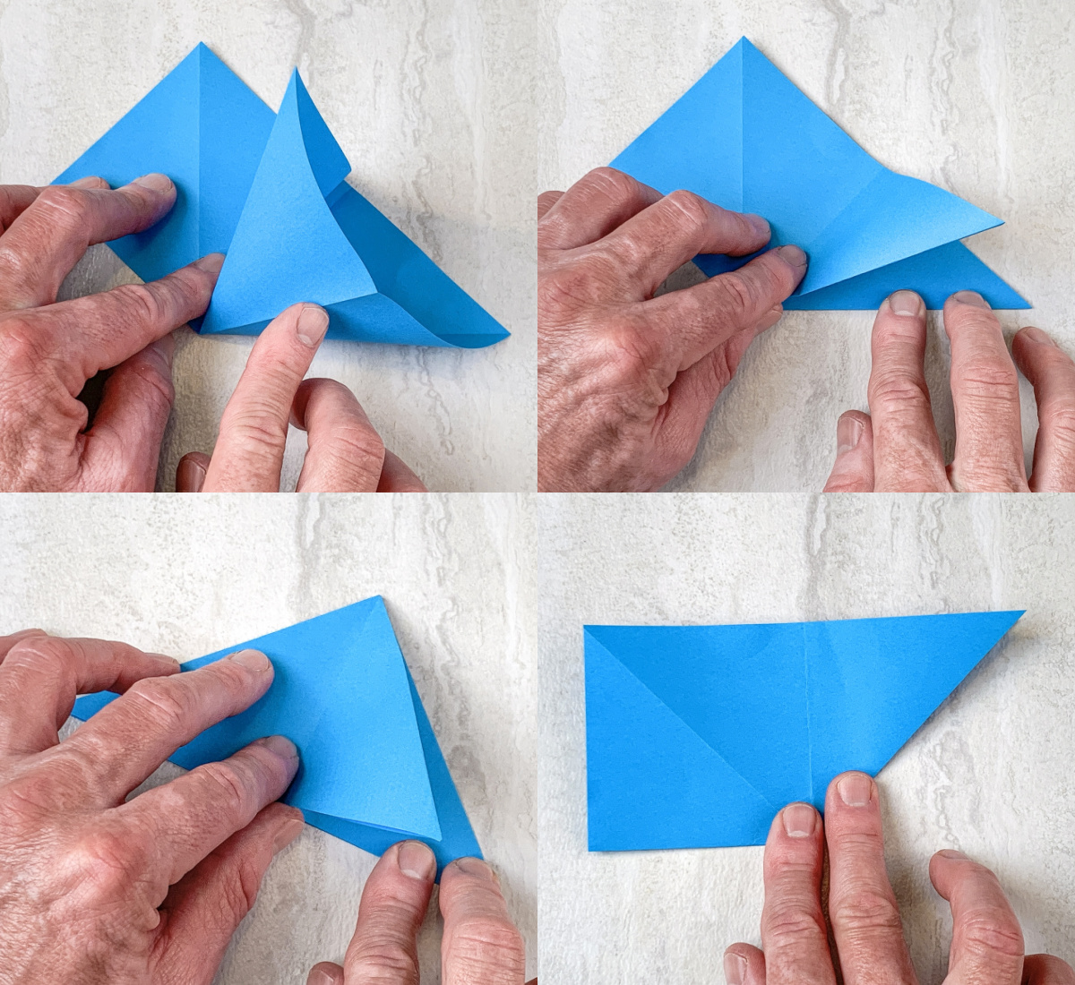 folding in both sides of the blue paper rectangle to form a triangle