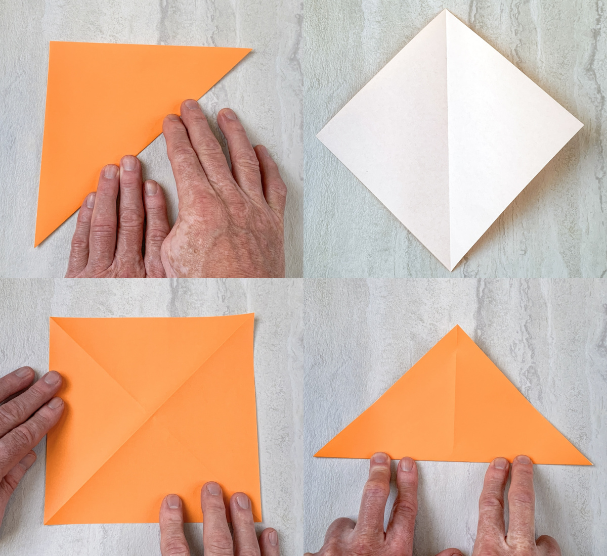 folding orange paper into a triangle and then opening up and folding into a triangle the other way