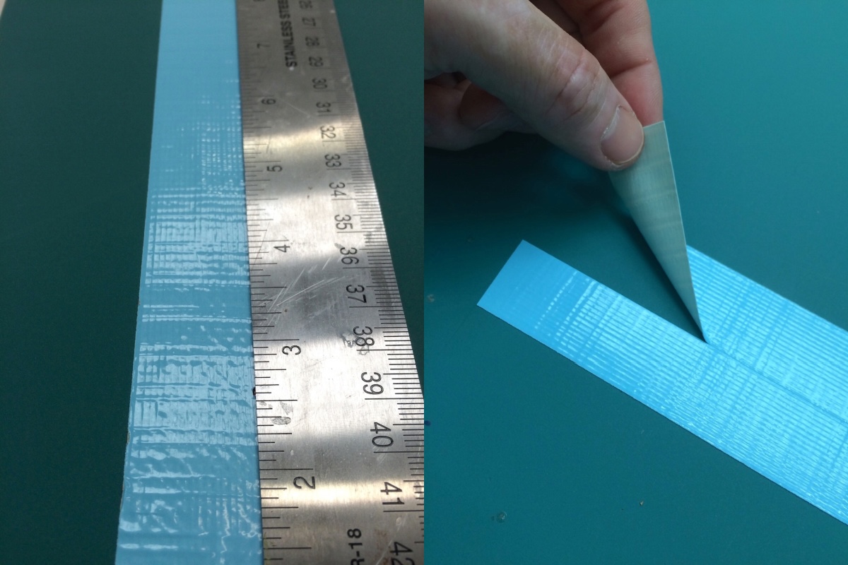 blue duck tape cut in half with a craft knife using a ruler