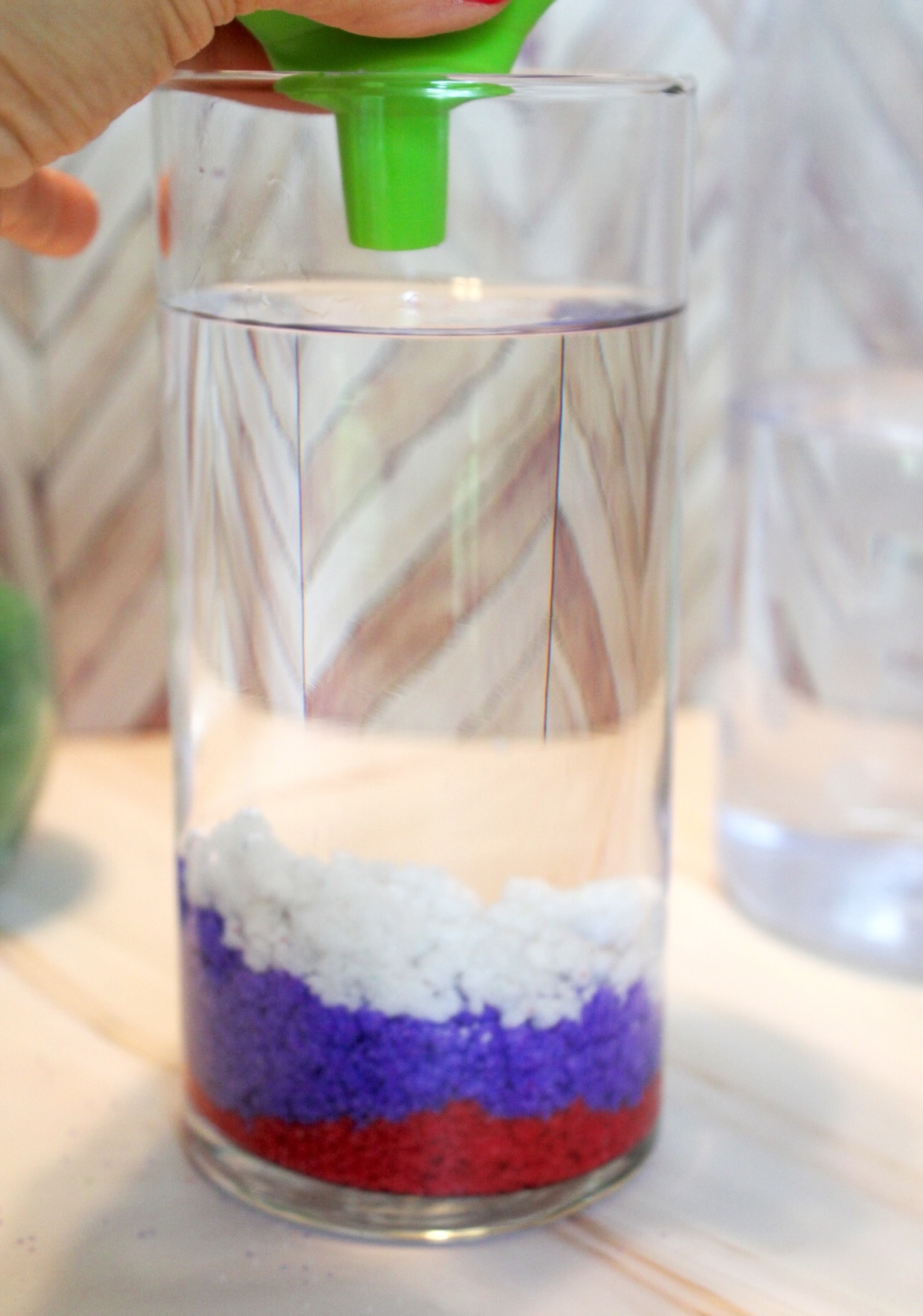 Add Sand to Water with Funnel