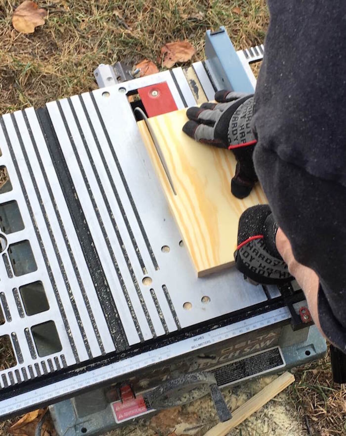 Cutting wood for bench legs on a table saw