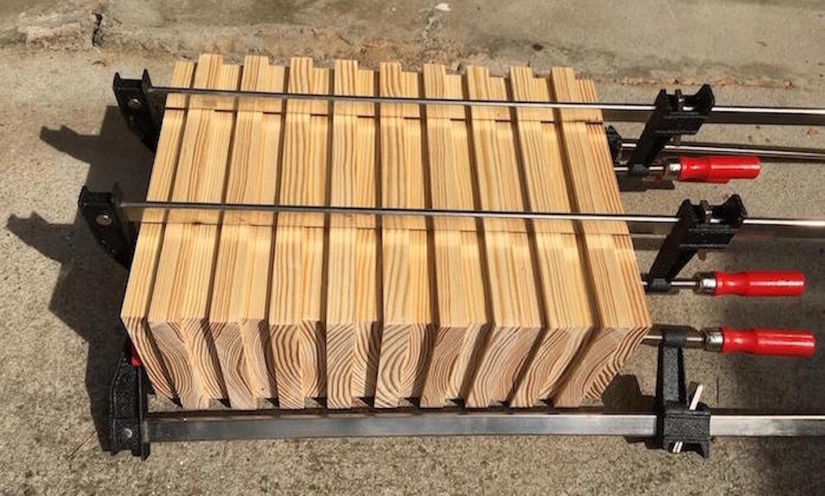 Glued bench legs held together with clamps