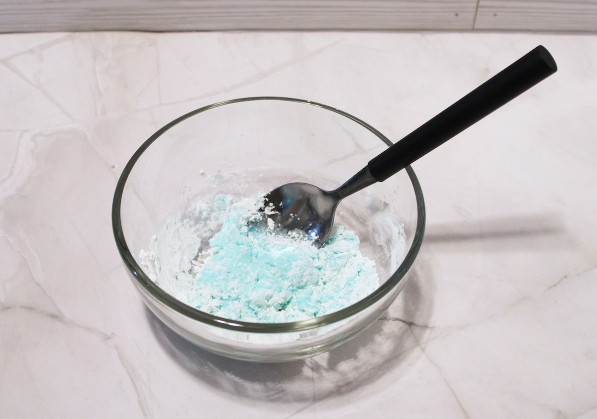 combining cornstarch and dishwashing liquid in a bowl