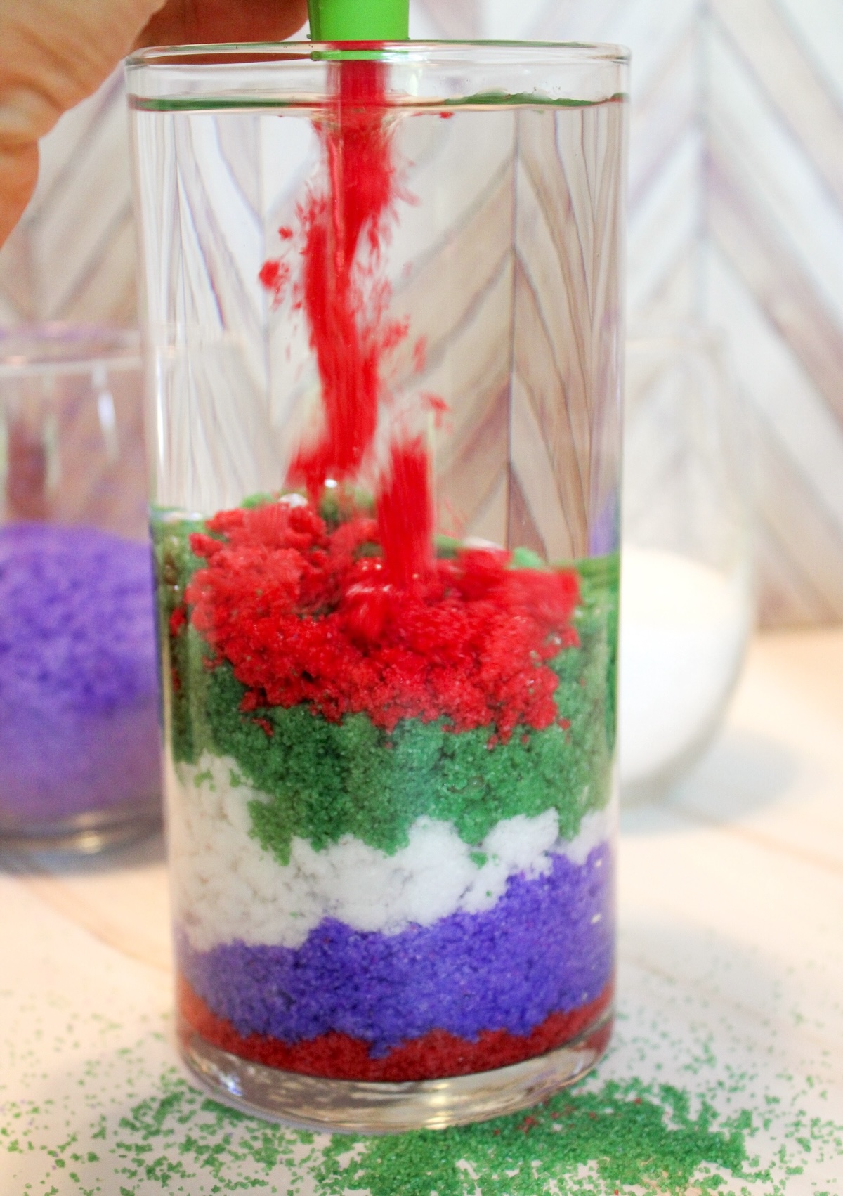 pouring hydrophobic sand into a container