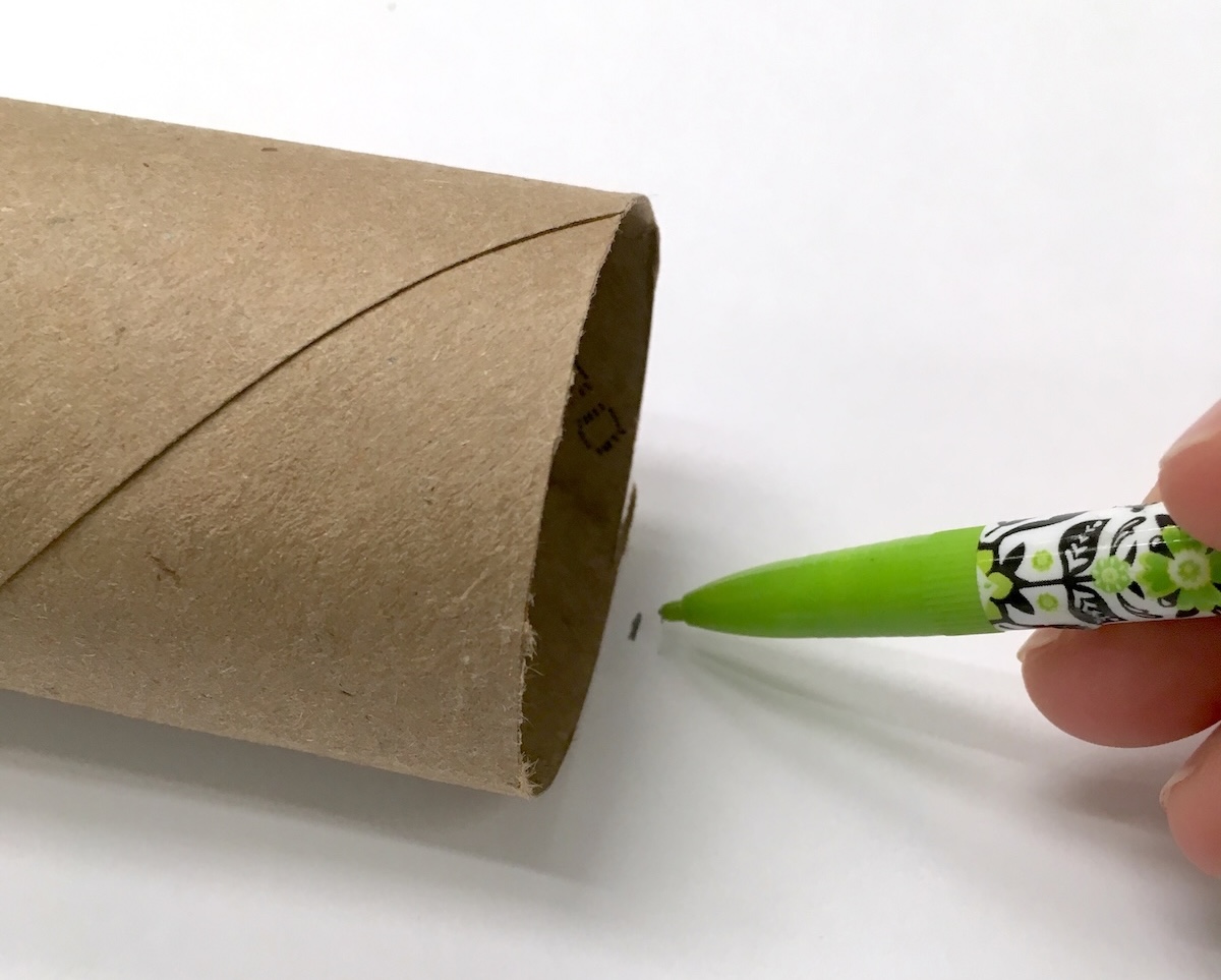 Trace a toilet paper roll on the back of paper with a pencil