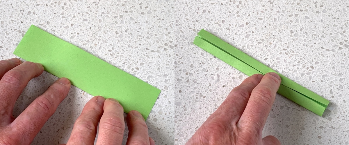 fold green origami paper in half then in half again