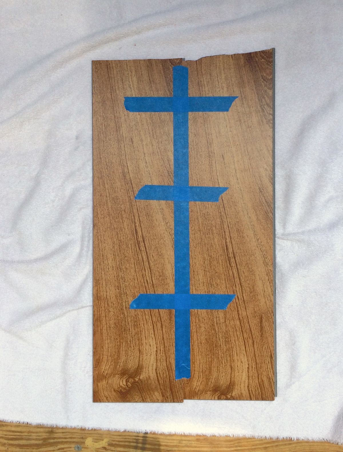 two pieces of flooring taped together