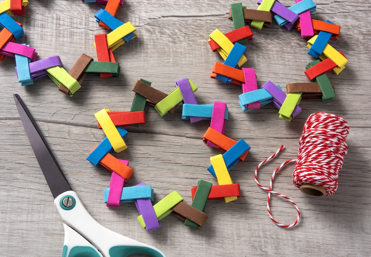 tying on red baker's twine to make ornament