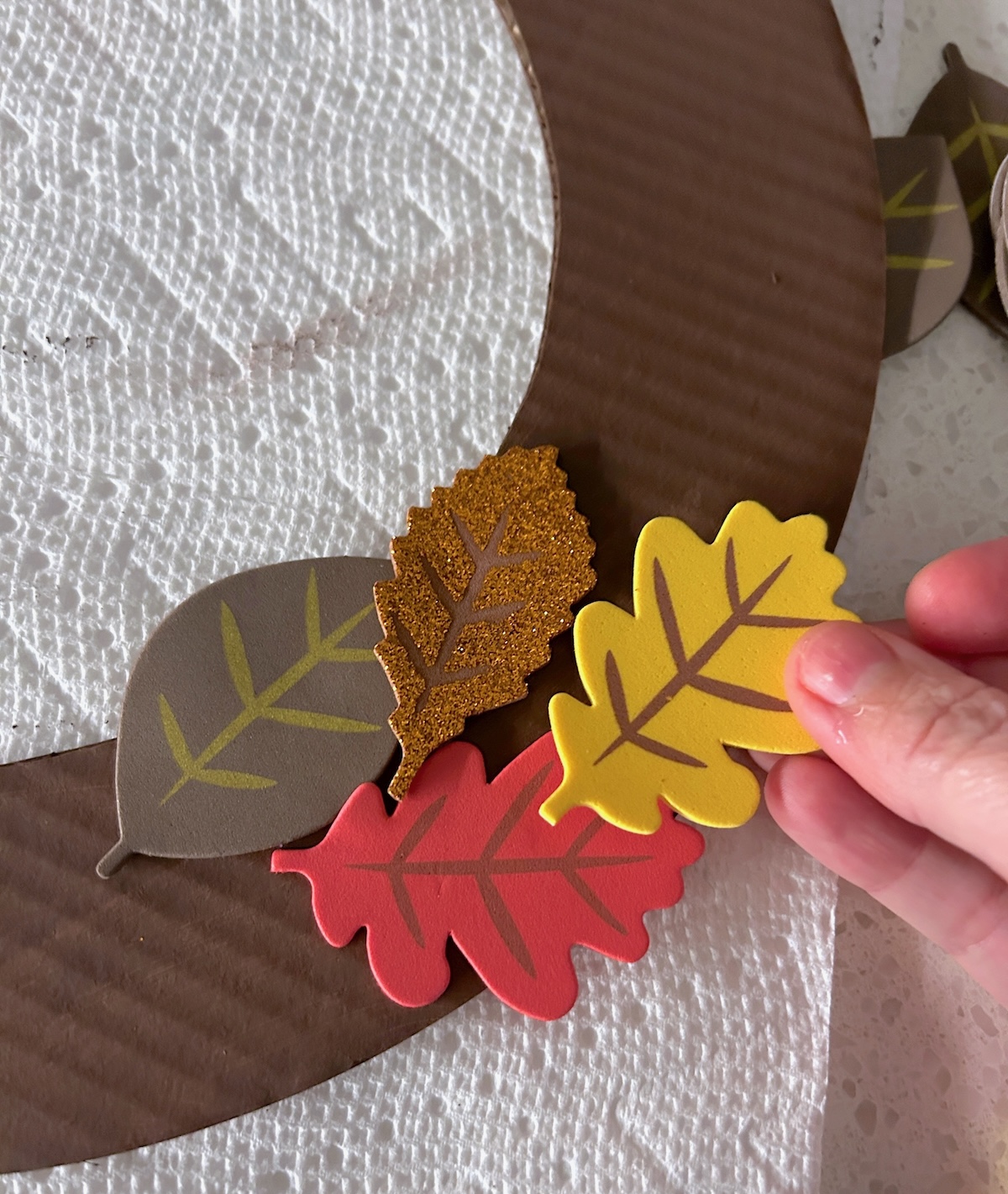 start adding glitter leave stickers